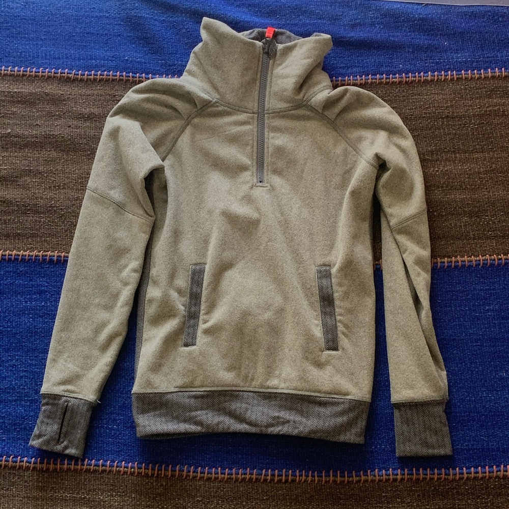 A Grey three quarter zip